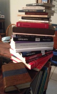 stack of 10th grade school books with bible 